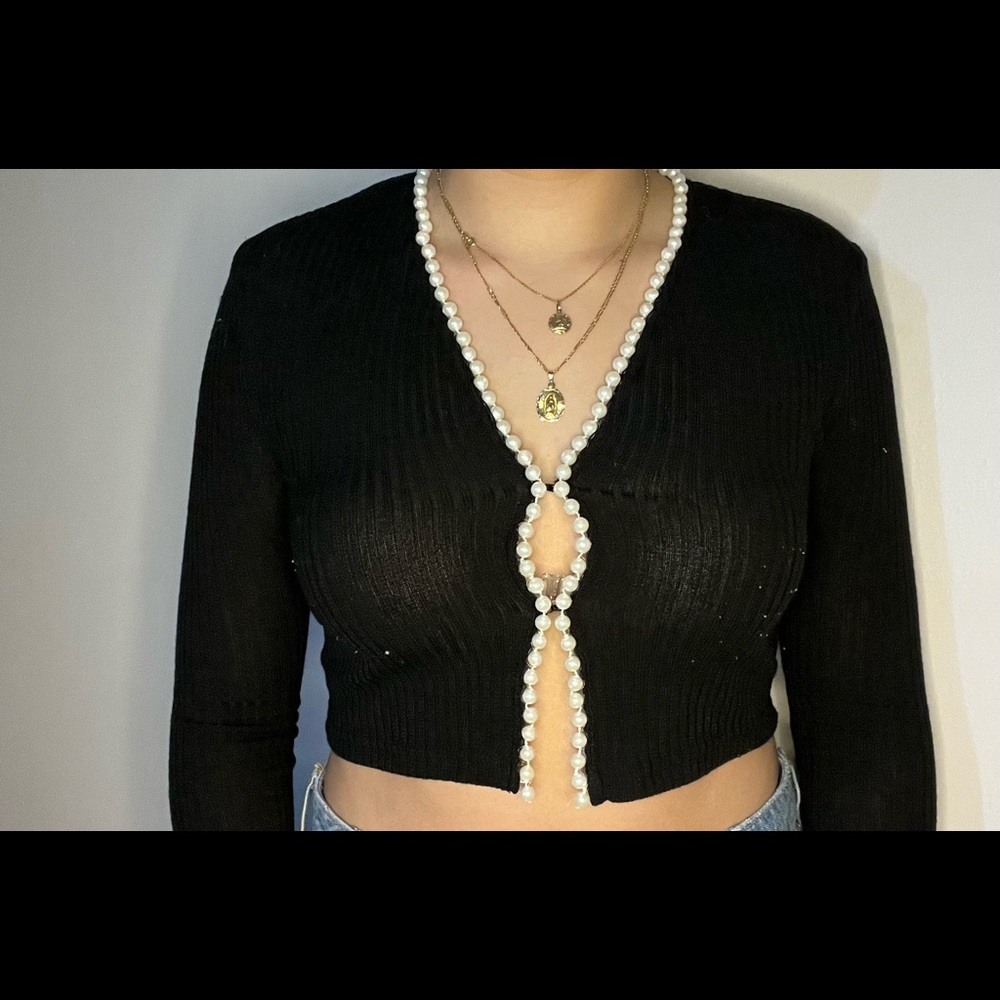 Fancy black ribbed top with pearls.
